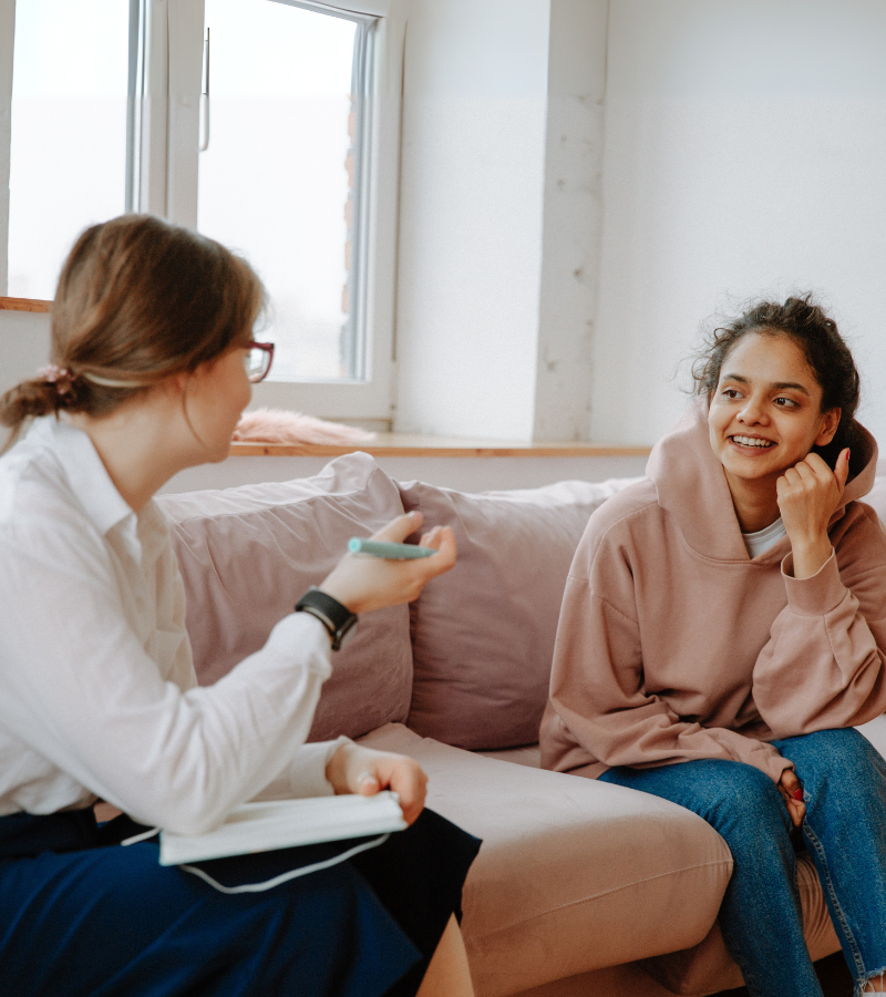 Counselor talking with a young woman
