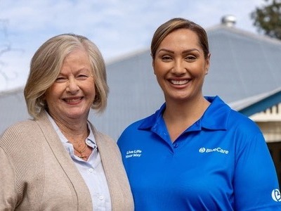 Elderly lady with bluecare employee