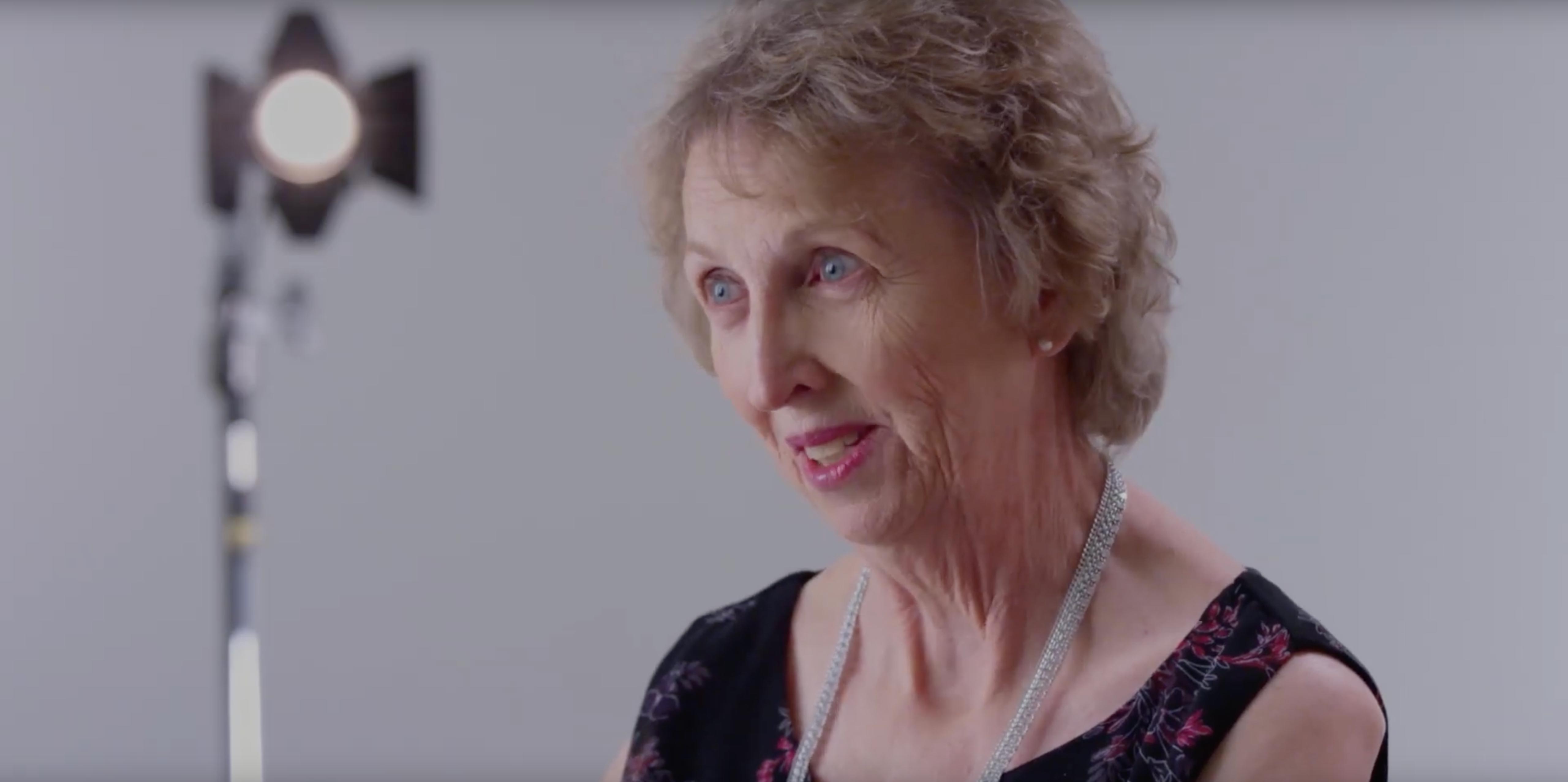 A smiling Nicole and her mum Jennifer sit side by side.