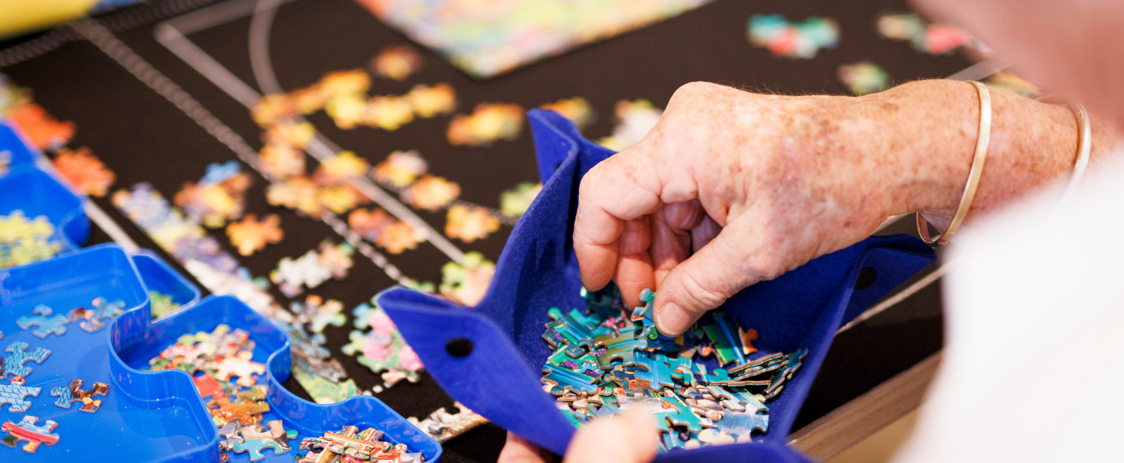 hands playing a puzzle