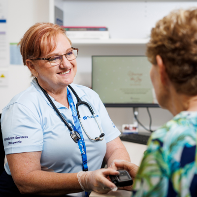 Bluecare staff member talking to client