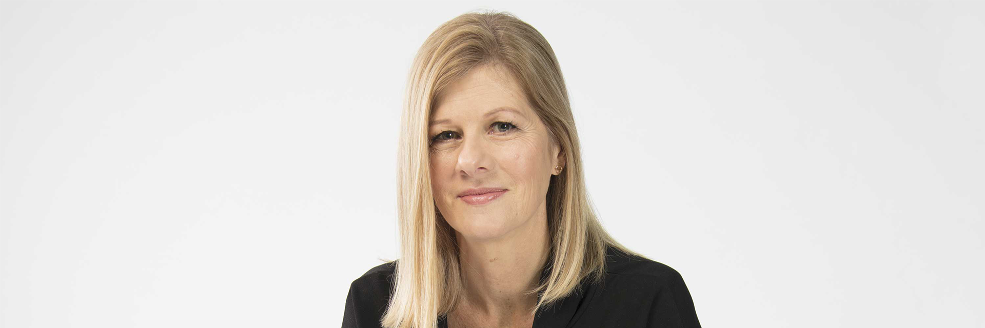 A picture of Lynne looking at the camera on a white background