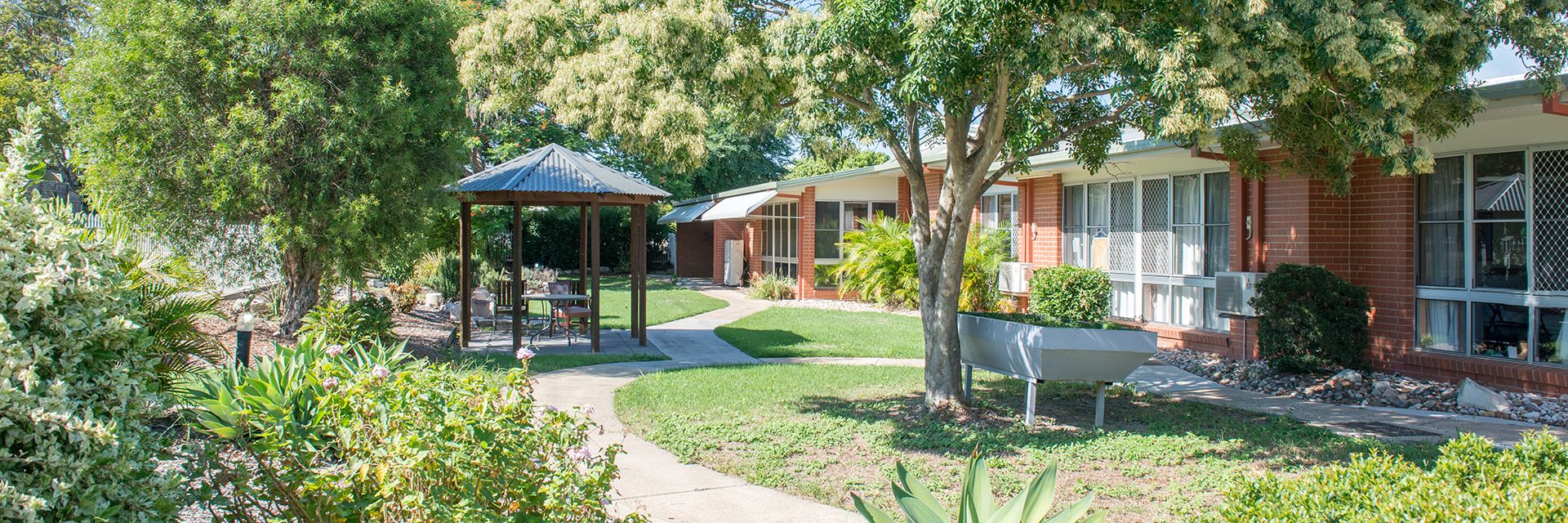 A pergola in the gardens of Blue Care Flinders View Nowlanvil Aged Care Facility is an inviting place to sit.