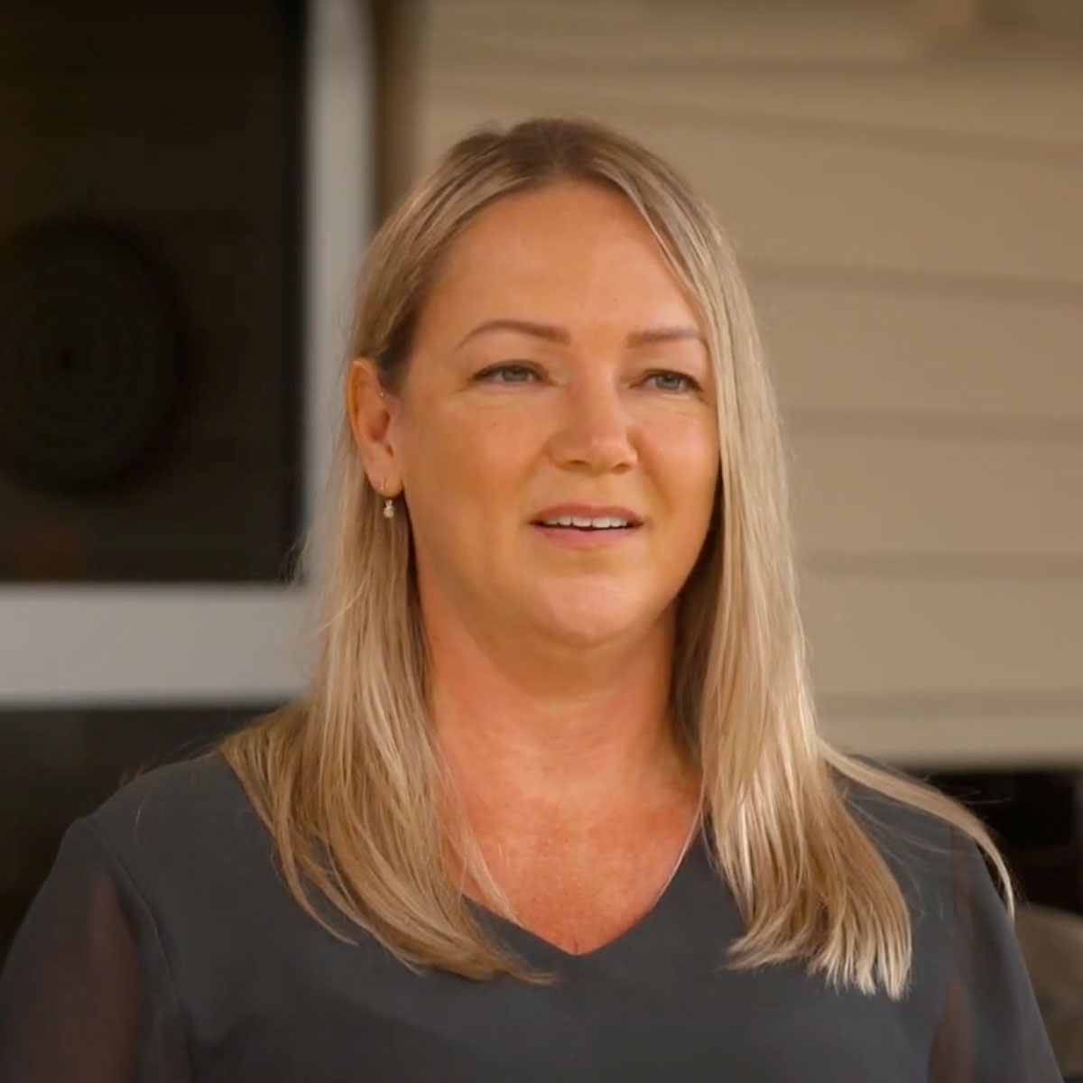 BlueCare volunteer Kylie smiling at camera