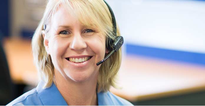 female receptionist smiling with headset on
