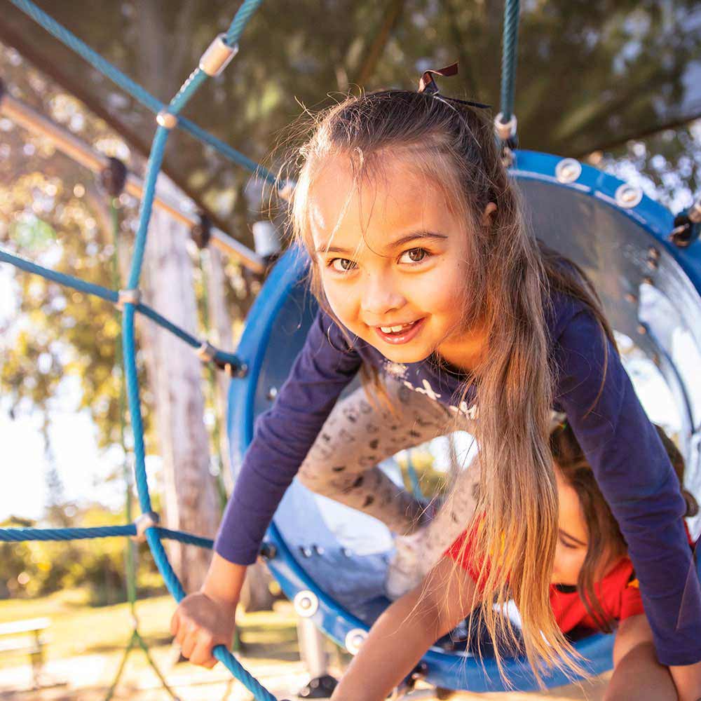 young girl playing outside