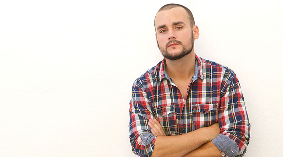 young man with a tartan shirt