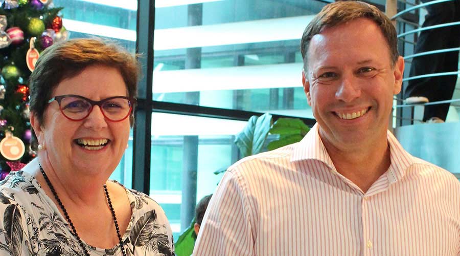 a man smiling in the office environment