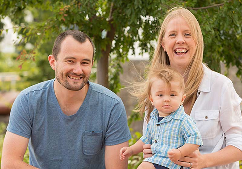 happy family with disabled child outside
