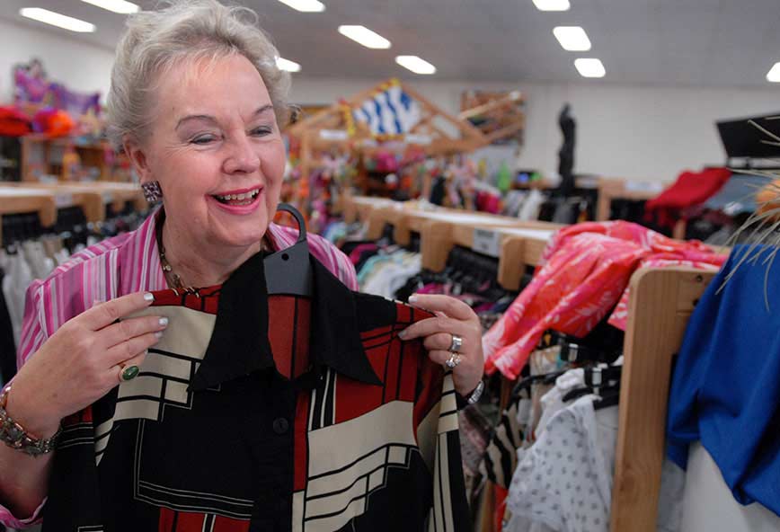 older woman shopping in lifeline clothing shop