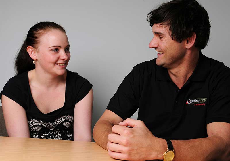 man and woman discuss mental health happily