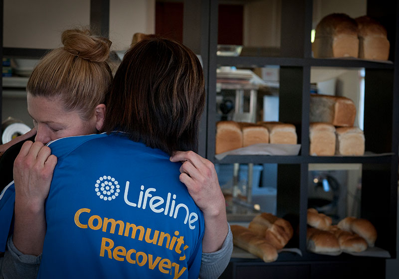 lifeline community recovery worker hugging woman