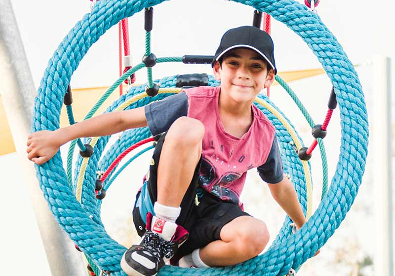 Young smiling boy in playground
