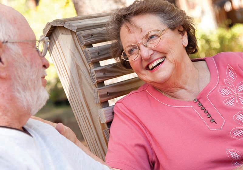 Elderly couple in backyard