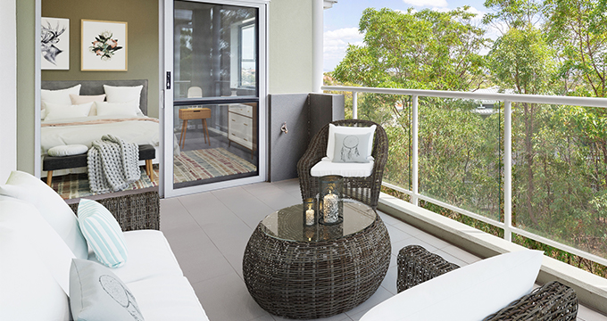 Picture of a balcony of a contemporary apartment with trees in the background