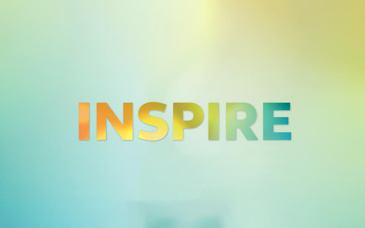 The word 'Inspire' masking a colourful background