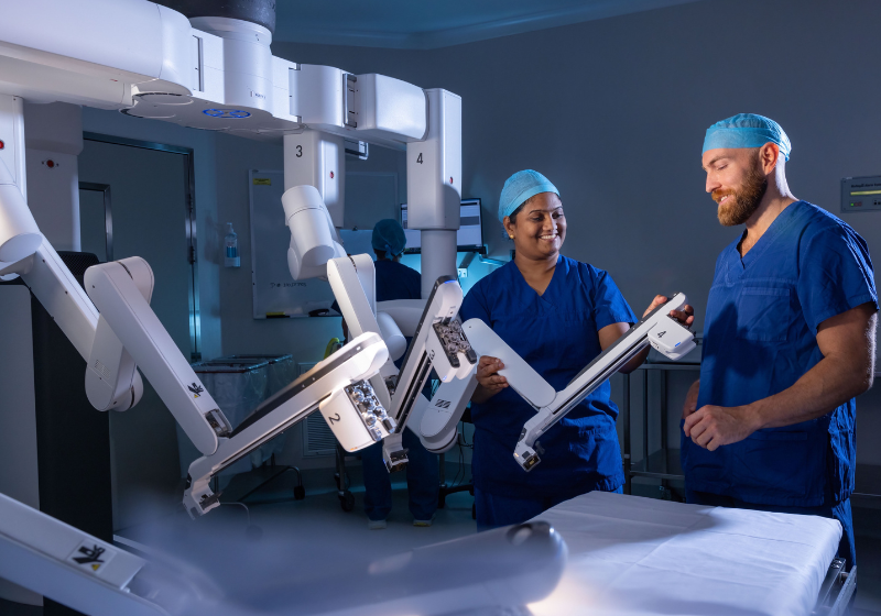 Theatre nurses prepare surgical robot for surgery